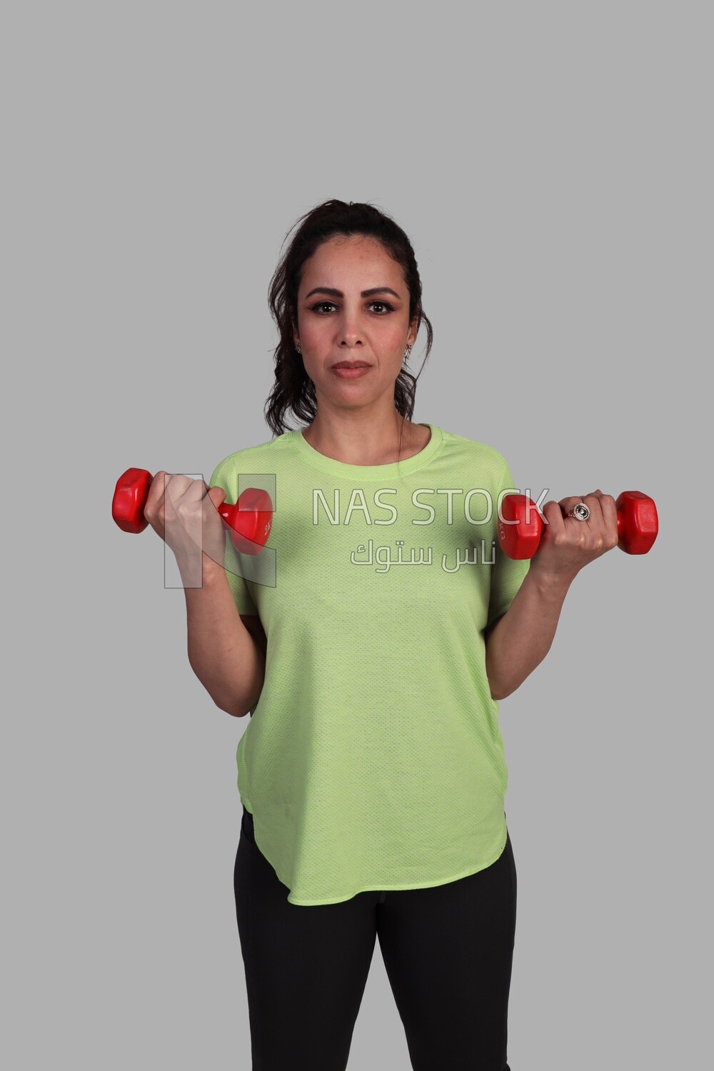 girl doing exercises using gym equipment