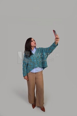 beautiful girl with long hair taking a selfie