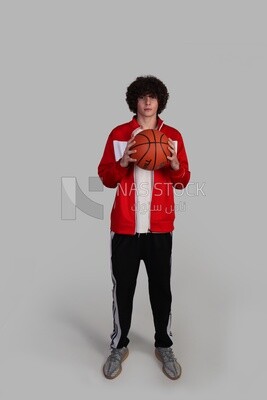 basketball player holding the ball