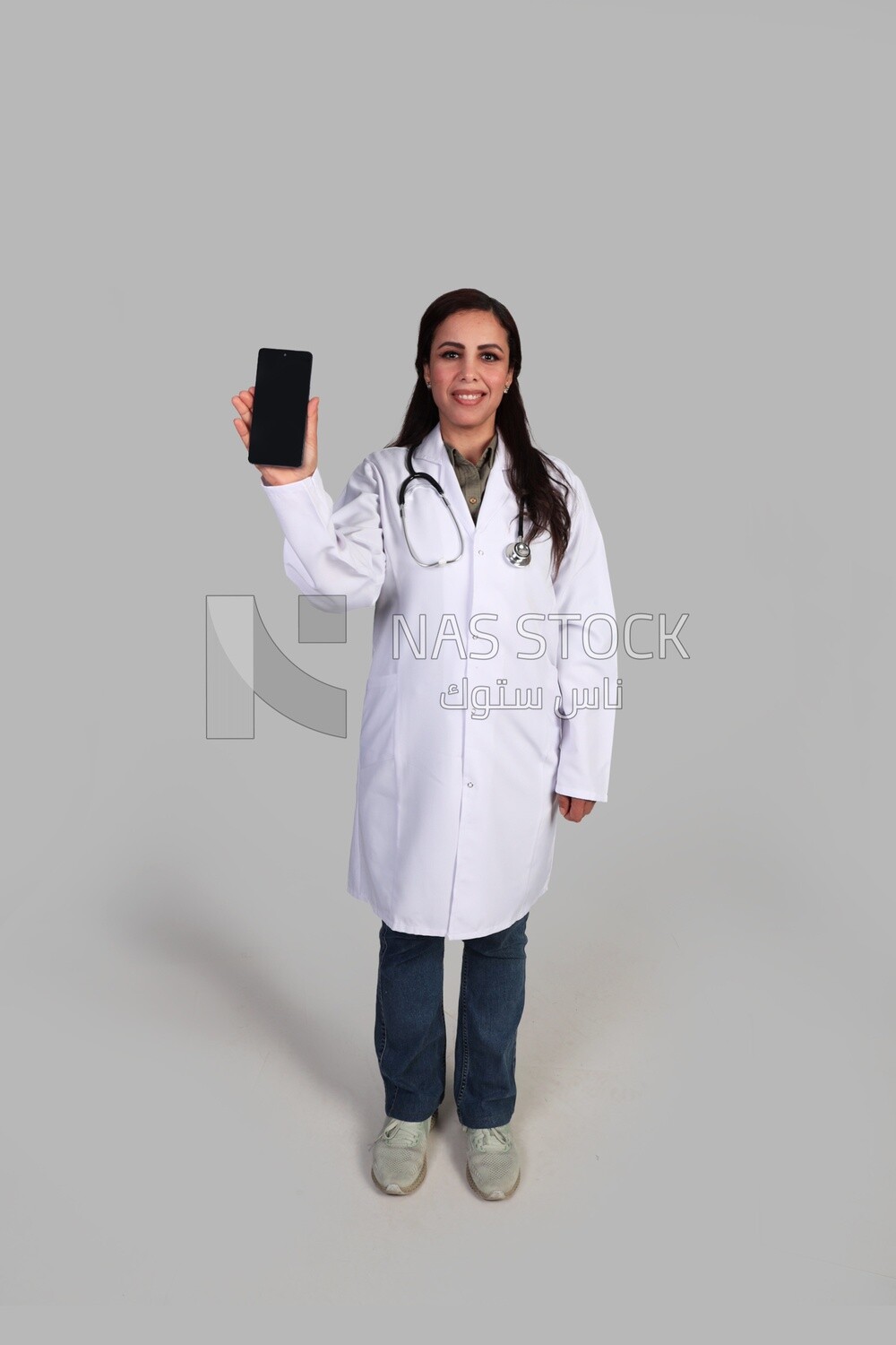 female doctor holding a phone