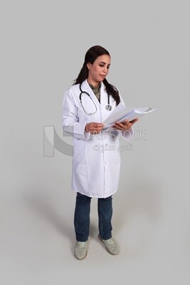 female doctor in a hospital uniform reviewing patient records, front view