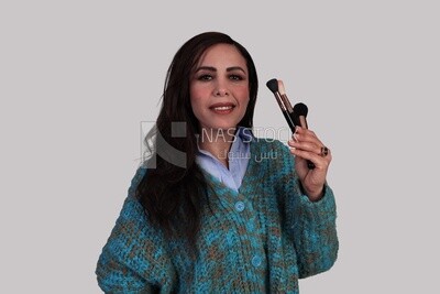 girl holding makeup brushes