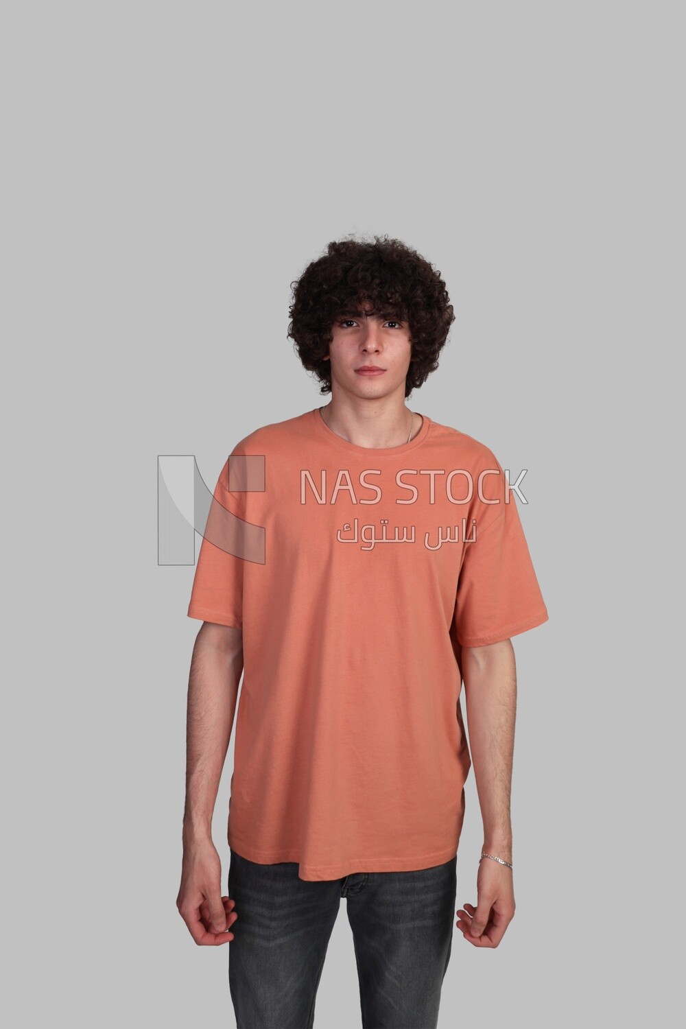 young man with curly hair smiling