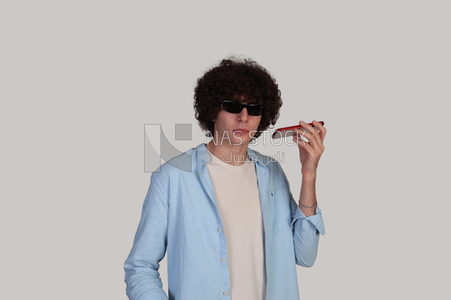 blind man making a phone call