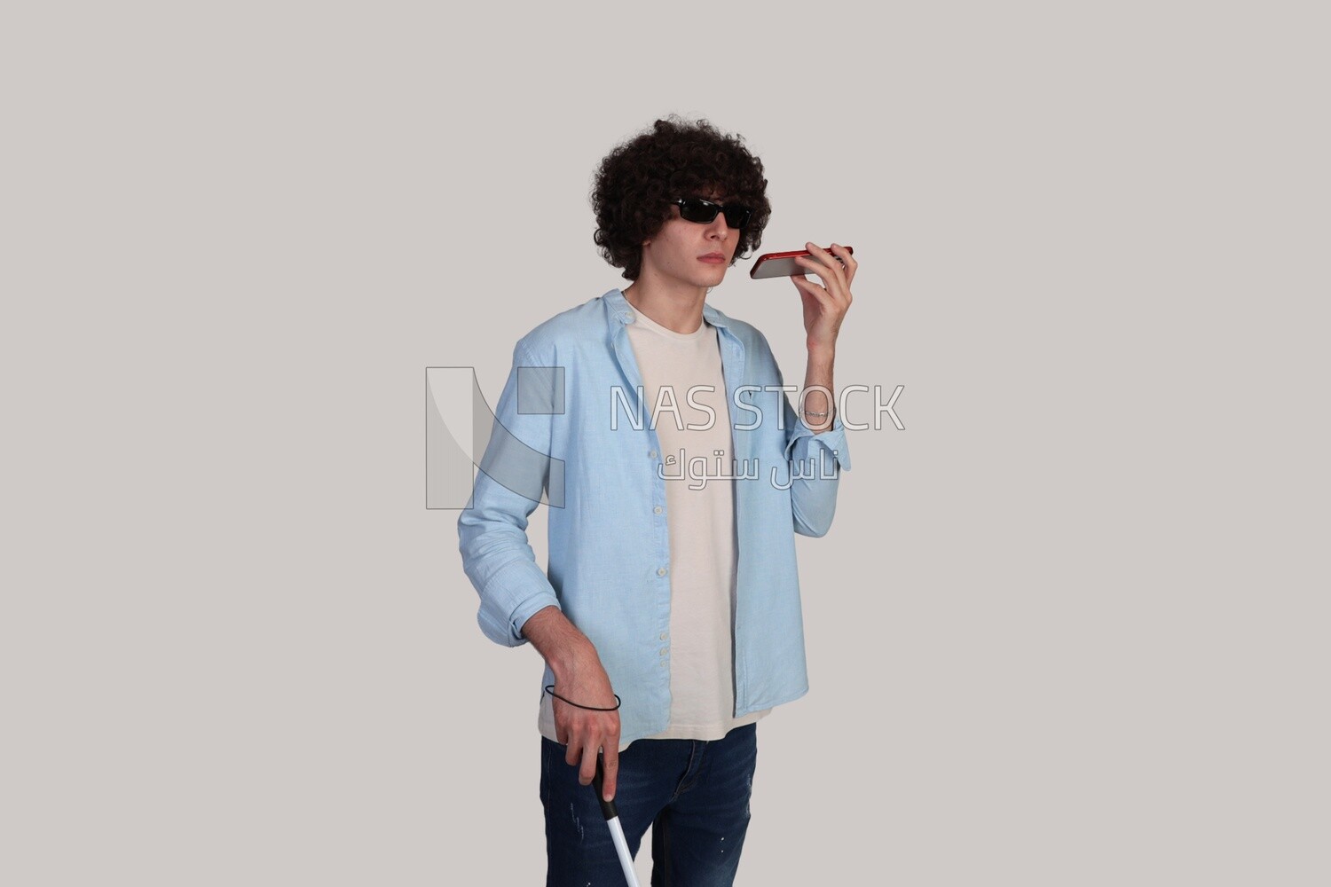 blind young man listening to an audio recording