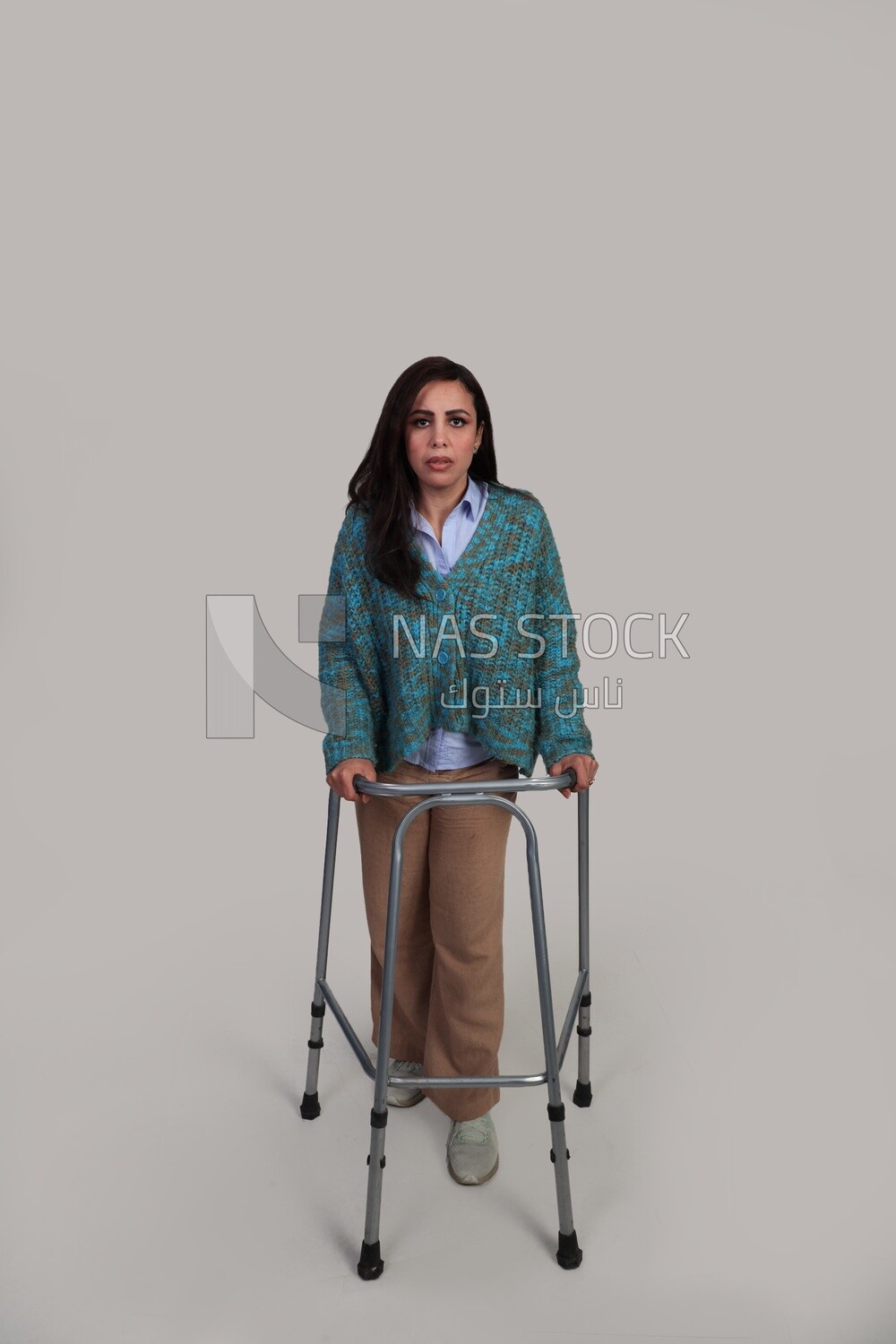 girl trying to walk with a walker