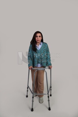 girl trying to walk with a walker