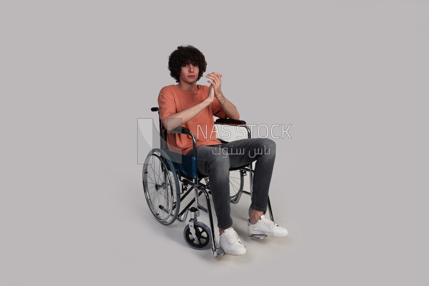 Disabled young man sitting in a wheelchair