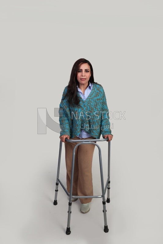 Injured girl trying to walk with a walker