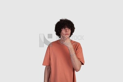 young man thinking and looking up