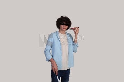 blind young man listening to an audio recording