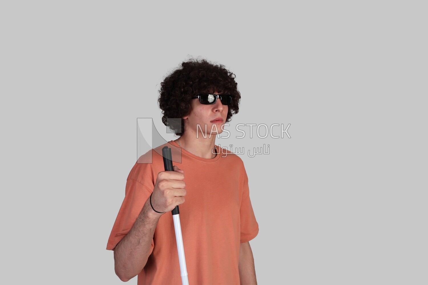 blind young man wearing sunglasses