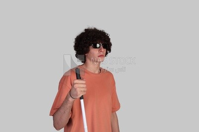 blind young man wearing sunglasses