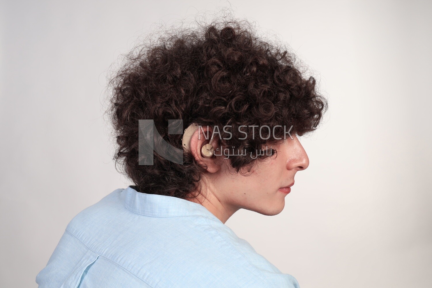 man wearing a hearing impaired earphone