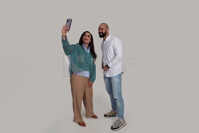 boy and his girlfriend taking selfies