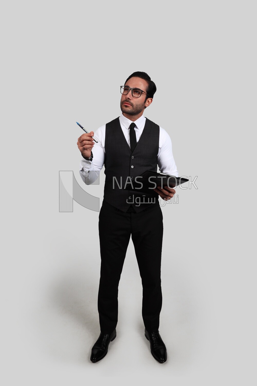 Photo of a businessman with a formal suit holding documents in one hand and a pen in the other, business development and partnerships, business meeting, Model