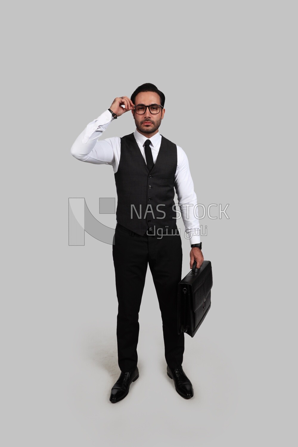 Photo of a businessman with a formal suit holding a leather bag, business development and partnerships, business meeting, Model