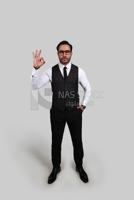 Photo of a businessman with a formal suit with hand gesture, business development and partnerships, business meeting, Model