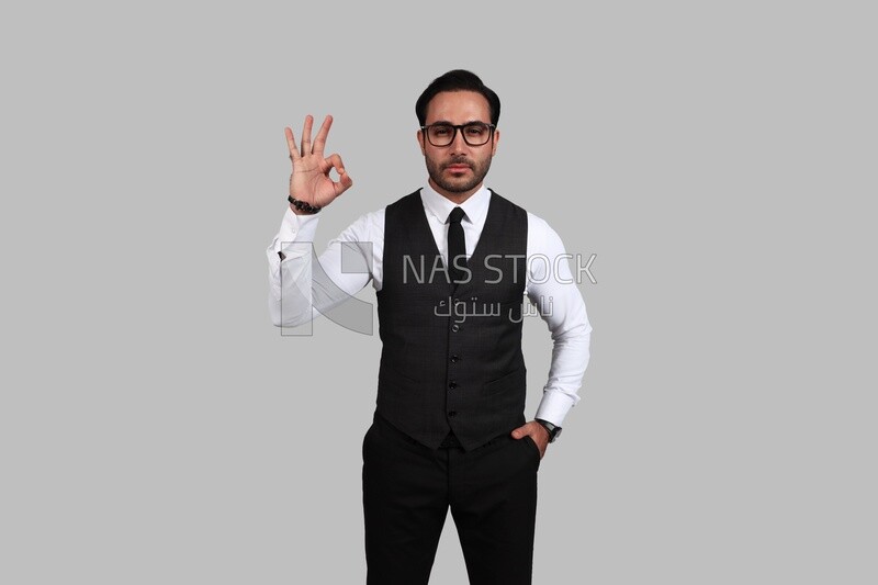 Photo of a businessman with a formal suit with hand gesture, business development and partnerships, business meeting, Model