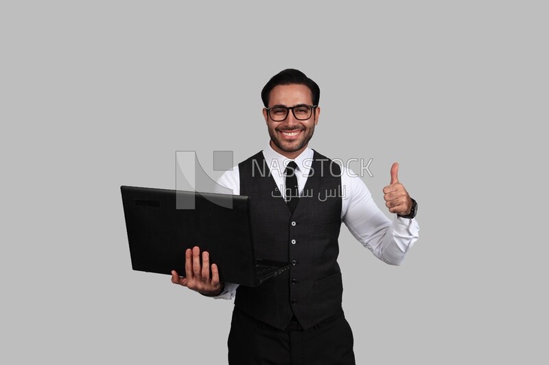 Photo of a businessman with a formal suit holding a laptop, business development and partnerships, business meeting, Model