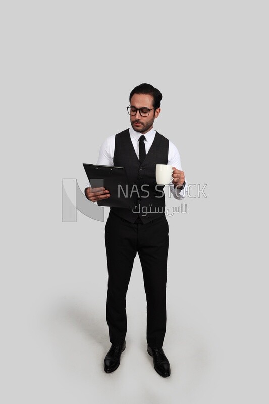 Photo of a businessman with a formal suit holding documents in one hand and a cup in the other, business development and partnerships, business meeting, Model