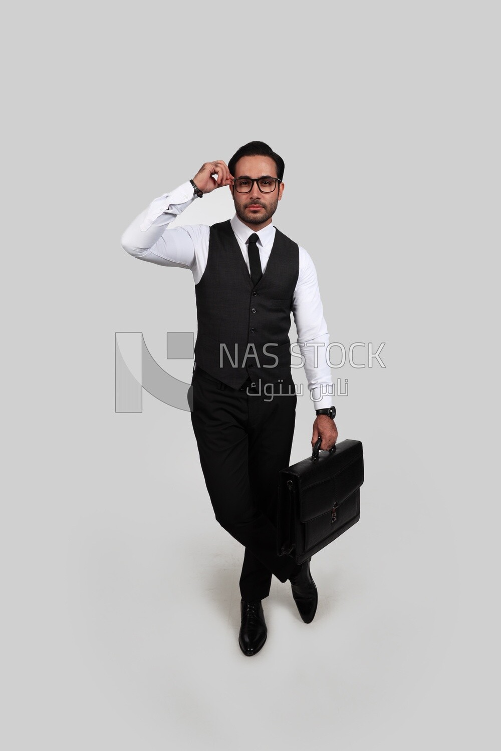 Businessman with a formal suit holding a leather bag, business development and partnerships, business meeting, Model