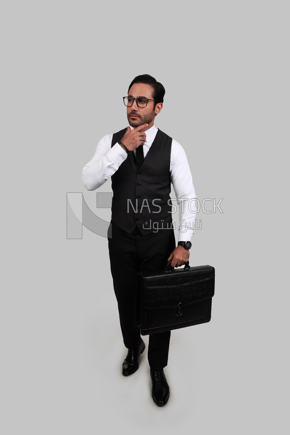 Photo of a businessman with a formal suit holding a leather bag and looking like he is thinking, business development and partnerships, business meeting, Model