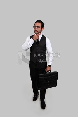 Photo of a businessman with a formal suit holding a leather bag and looking like he is thinking, business development and partnerships, business meeting, Model
