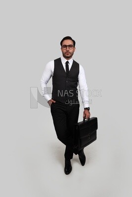 Photo of a businessman with a formal suit holding a leather bag, business development and partnerships, business meeting, Model