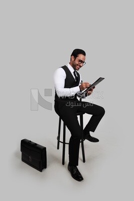 Photo of a businessman with a formal suit holding documents in one hand and a pen in the other, business development and partnerships, business meeting, Model