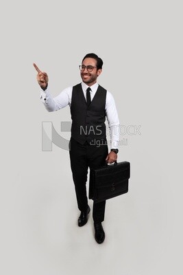 Photo of a businessman with a formal suit holding a leather bag pointing away, business development and partnerships, business meeting, Model