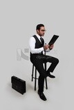 Photo of a businessman with a formal suit holding documents in one hand and a pen in the other, business development and partnerships, business meeting, Model