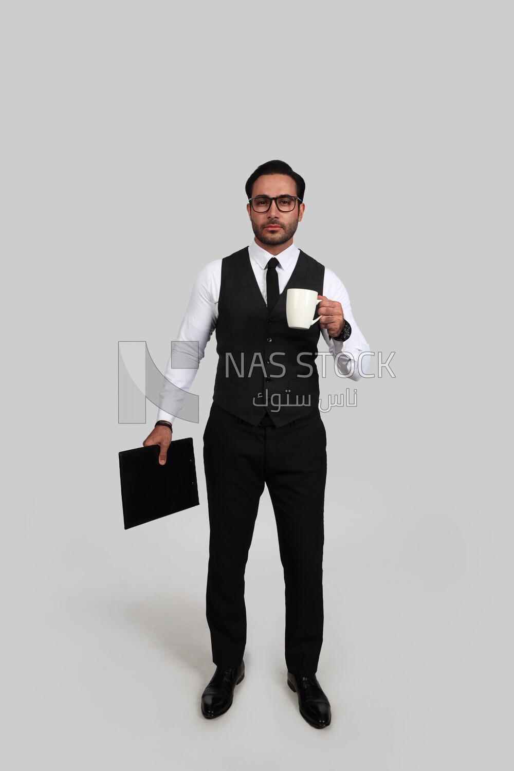 Photo of a businessman with a formal suit holding documents in one hand and a cup in the other, business development and partnerships, business meeting, Model