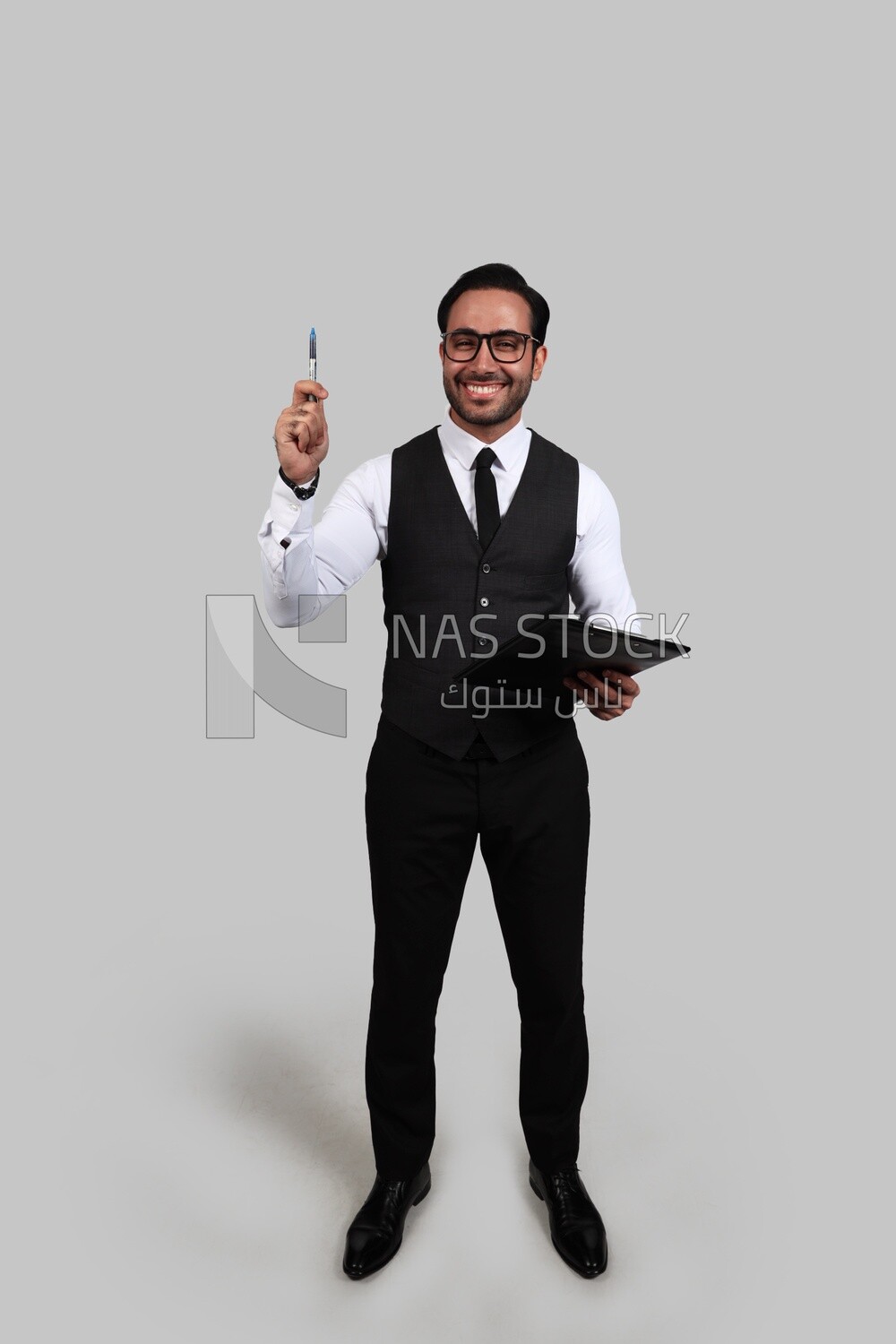 Photo of a businessman with a formal suit holding documents in one hand and a pen in the other, business development and partnerships, business meeting, Model