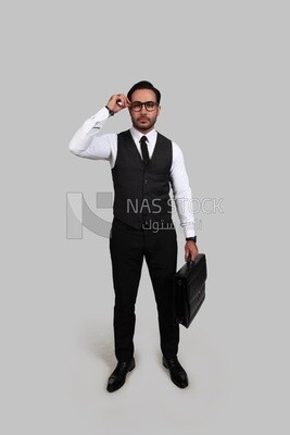 Photo of a businessman with a formal suit holding a leather bag, business development and partnerships, business meeting, Model