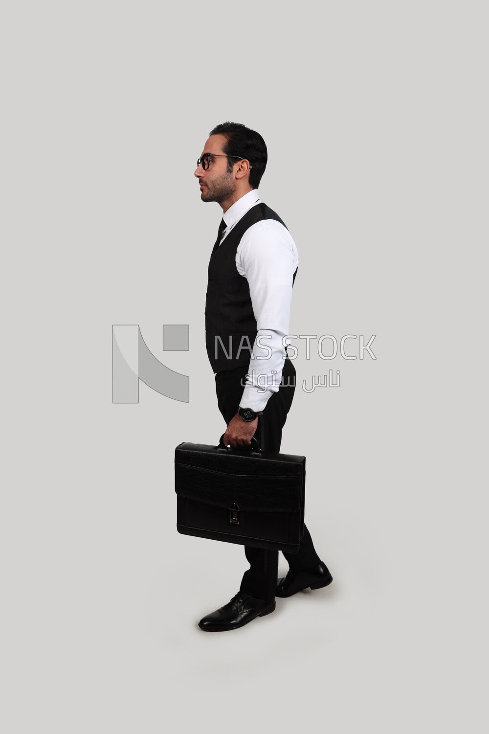 Photo of a businessman with a formal suit holding a leather bag, business development and partnerships, business meeting, Model