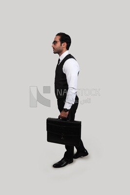 Photo of a businessman with a formal suit holding a leather bag, business development and partnerships, business meeting, Model