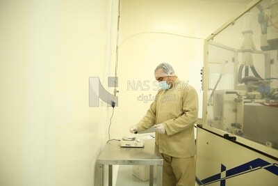 Worker in a pharmaceutical factory