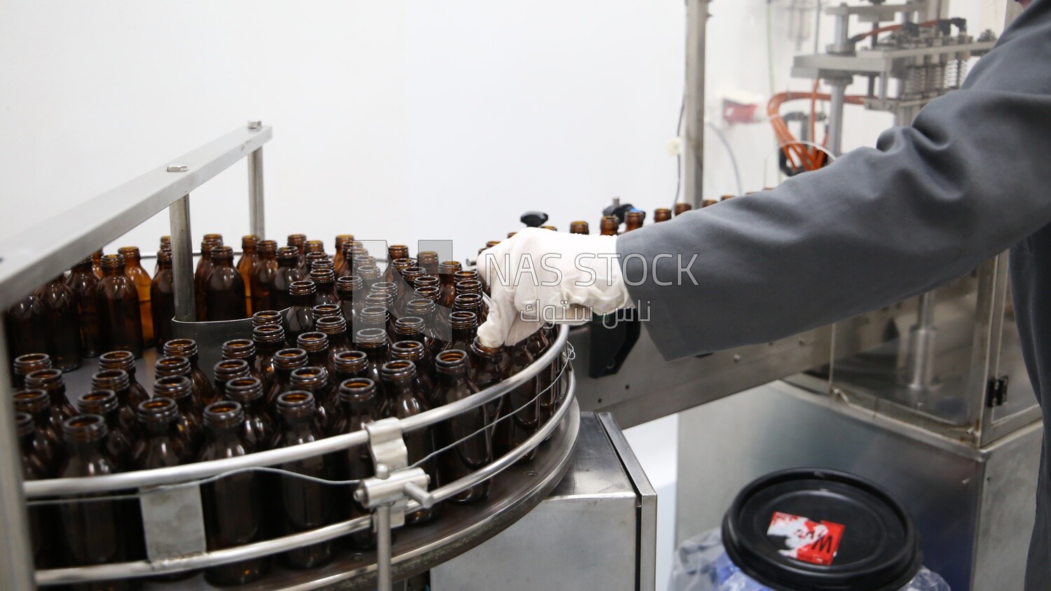 Stacked bottles in a machine, industries, medical medicine industry, packaging