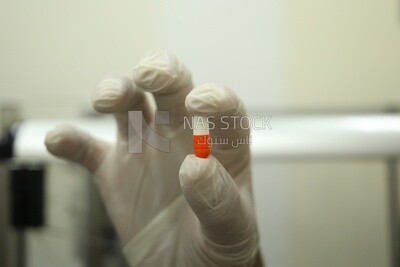 Man holding pill