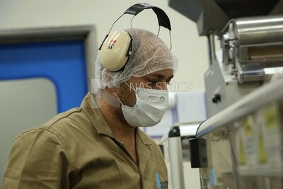 Worker in a pharmaceutical factory