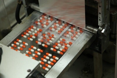 Stage of assembling the drug strips after packaging and pressing them