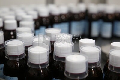 Medication bottles after filling and wrapping them