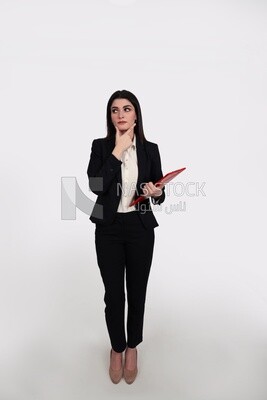 Photo of a businesswoman with a formal suit standing and holding documents looks like she is thinking, business development and partnerships, business meeting, Model