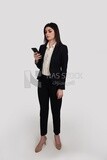 Photo of a businesswoman with formal wear holding a mobile phone, business development and partnerships, business meeting, Model