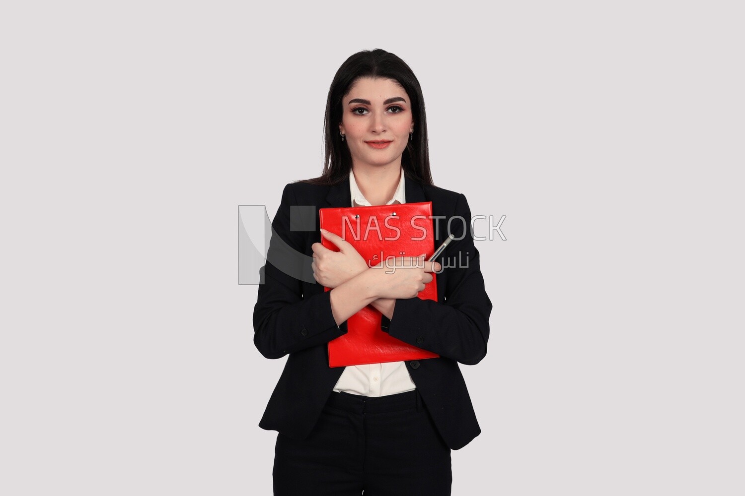 Photo of a businesswoman with a formal suit standing and holding documents, business development and partnerships, business meeting, Model
