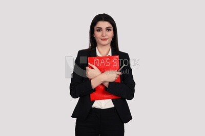 Photo of a businesswoman with a formal suit standing and holding documents, business development and partnerships, business meeting, Model