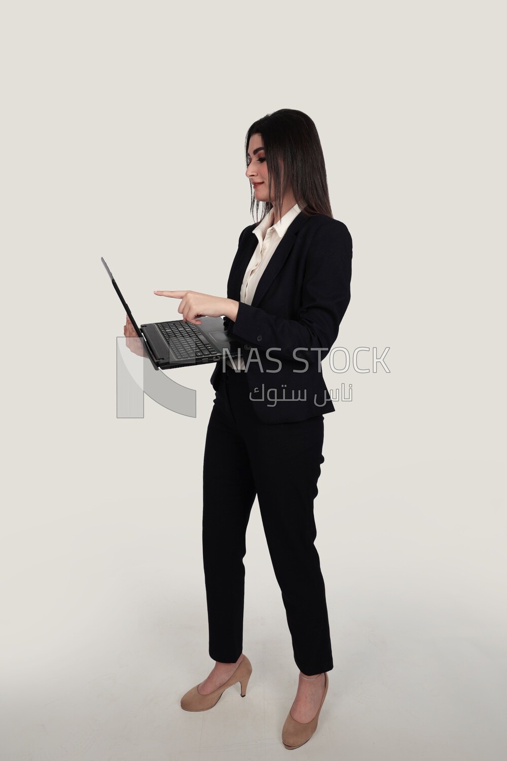 Photo of a businesswoman with a formal suit holding a laptop, business development and partnerships, business meeting, Model