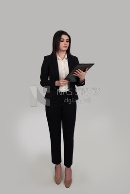 Photo of a businesswoman with a formal suit standing and holding documents, business development and partnerships, business meeting, Model
