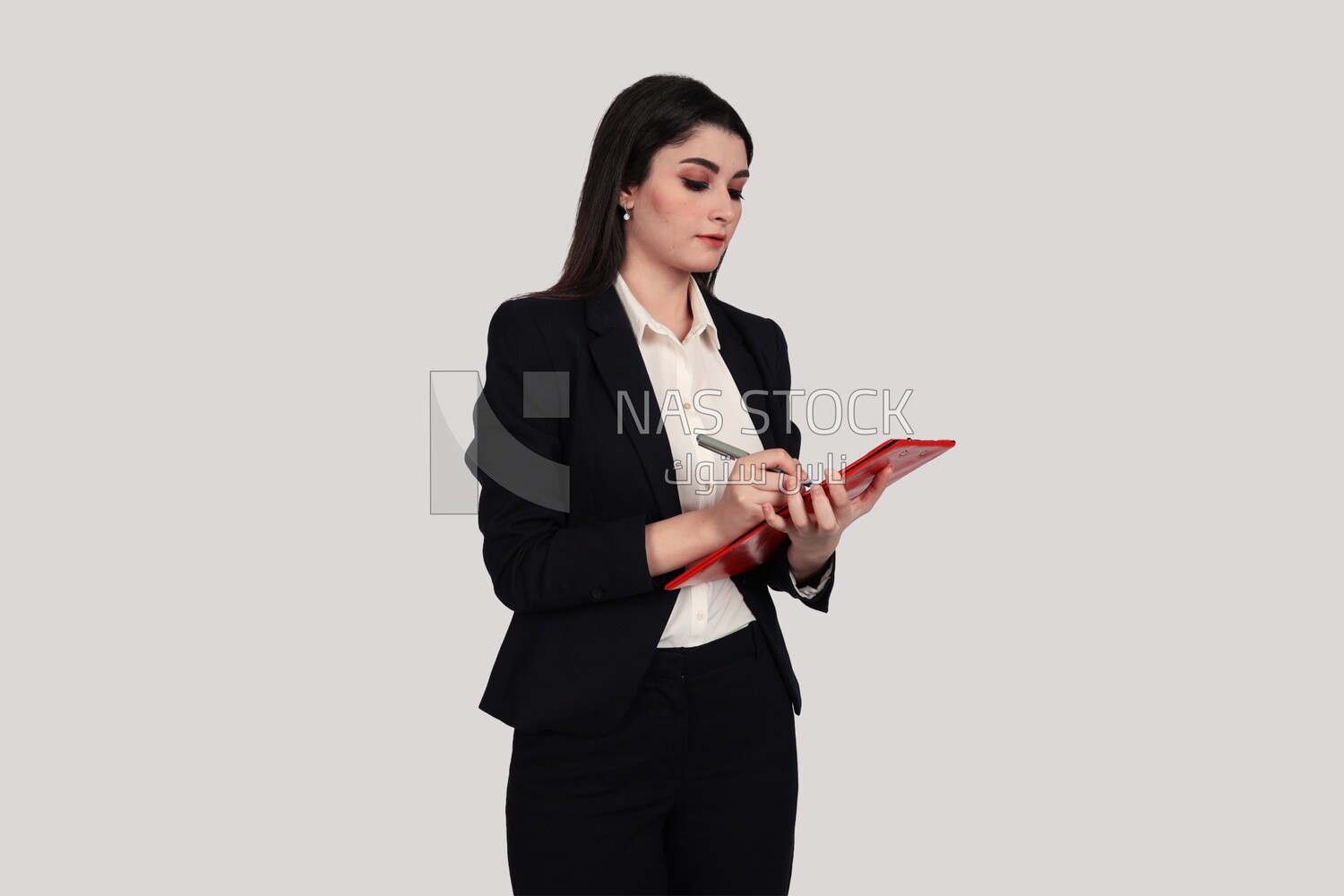 Photo of a businesswoman with a formal suit standing and holding documents, business development and partnerships, business meeting, Model